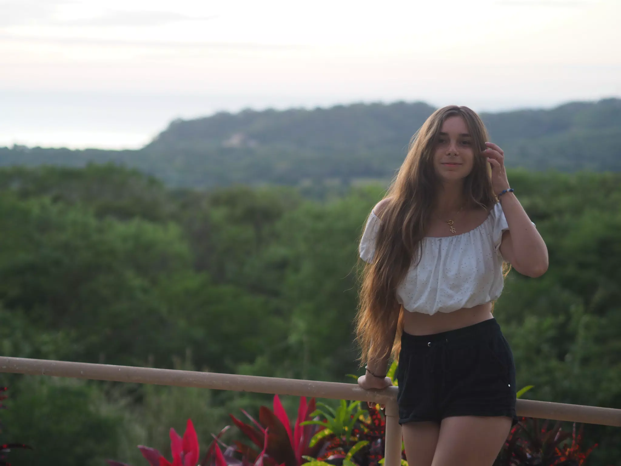 Young Model Adjusting Hair in Photoshoot in San Juan del Sur, Nicaragua
