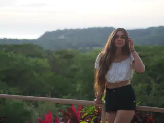 Young Model Adjusting Hair in Photoshoot in San Juan del Sur, Nicaragua