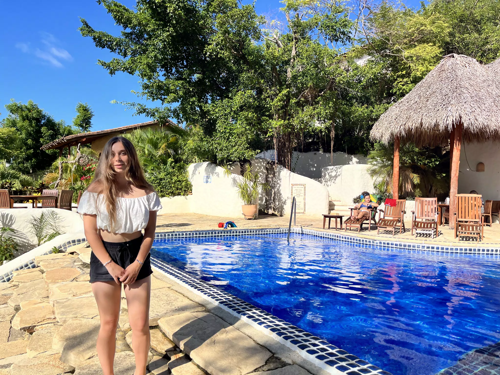 Camille in Shorts by the Pool at La Cascada at Pelican Eyes in San Juan del Sur