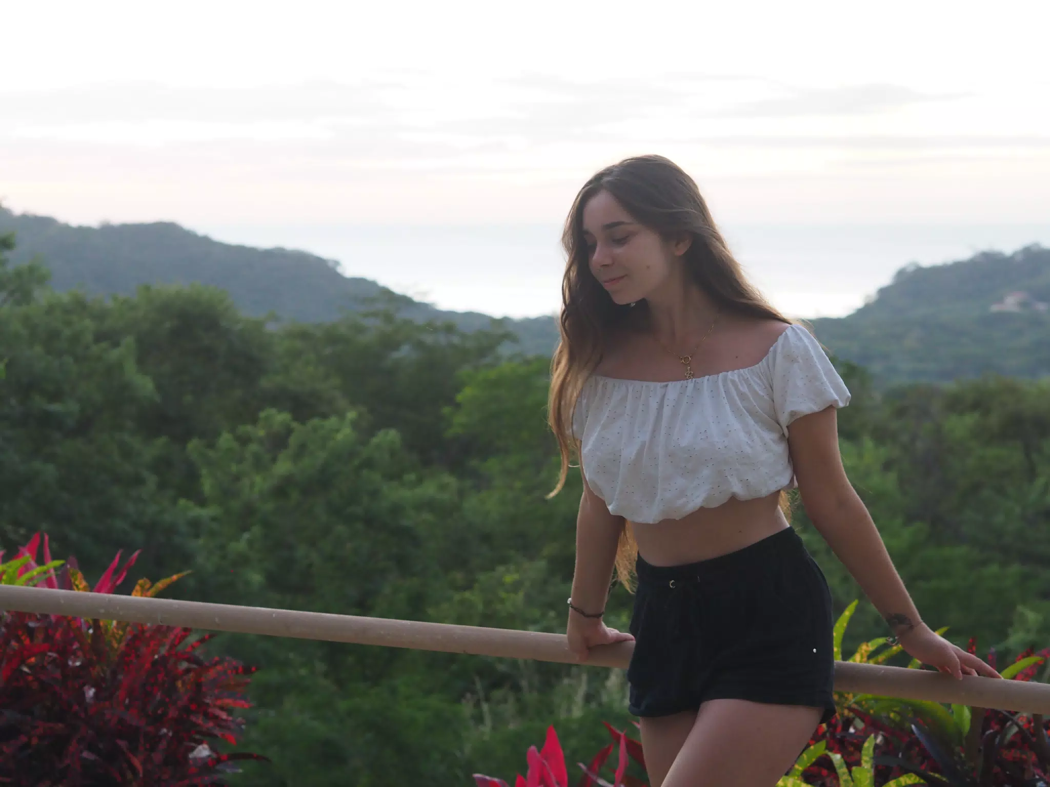 Camille in White Top and Shorts by Pacific Ocean