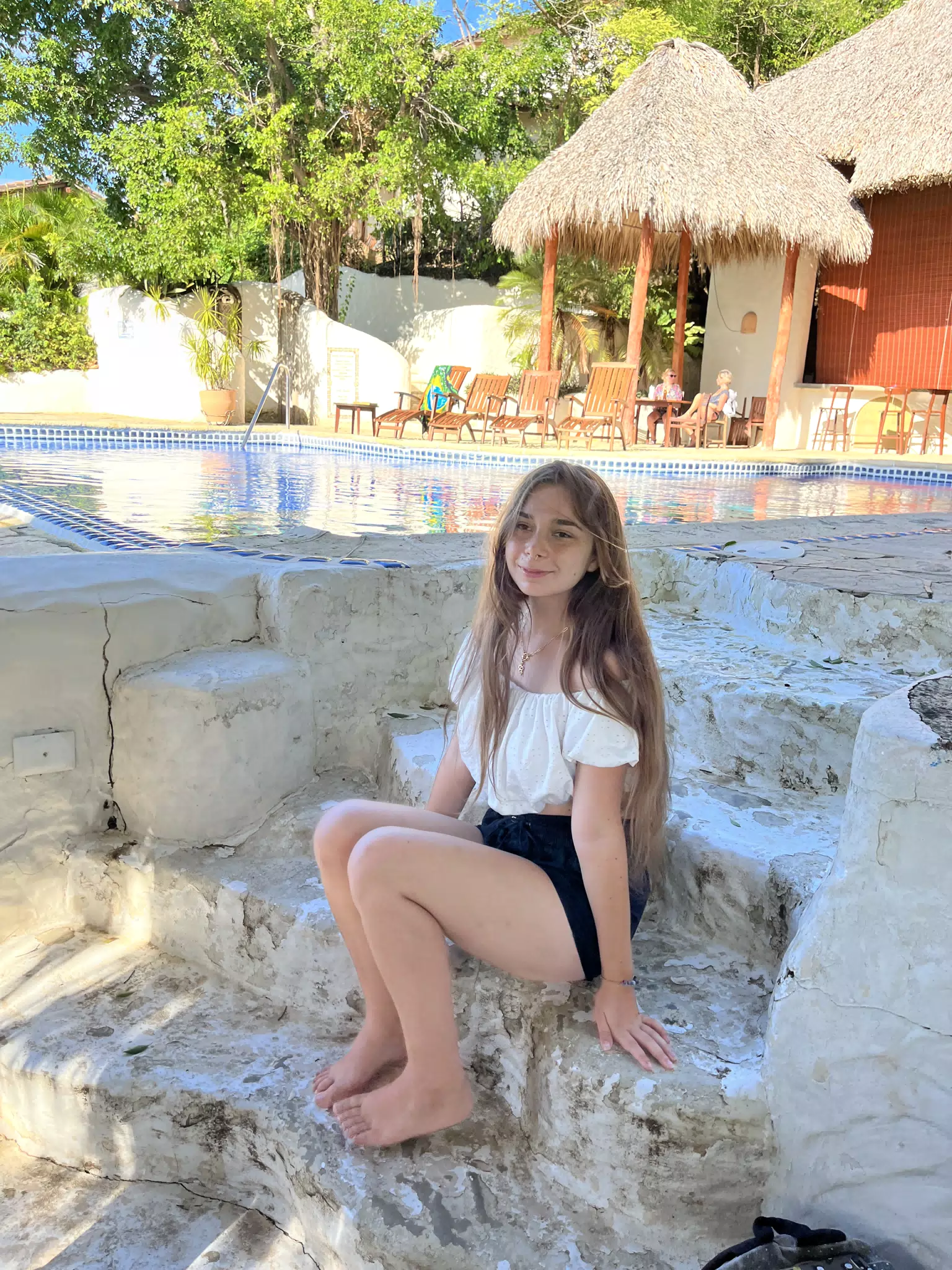 Camille Sitting on Steps by Pool at La Cascada, Pelican Eyes, San Juan del Sur, Nicaragua