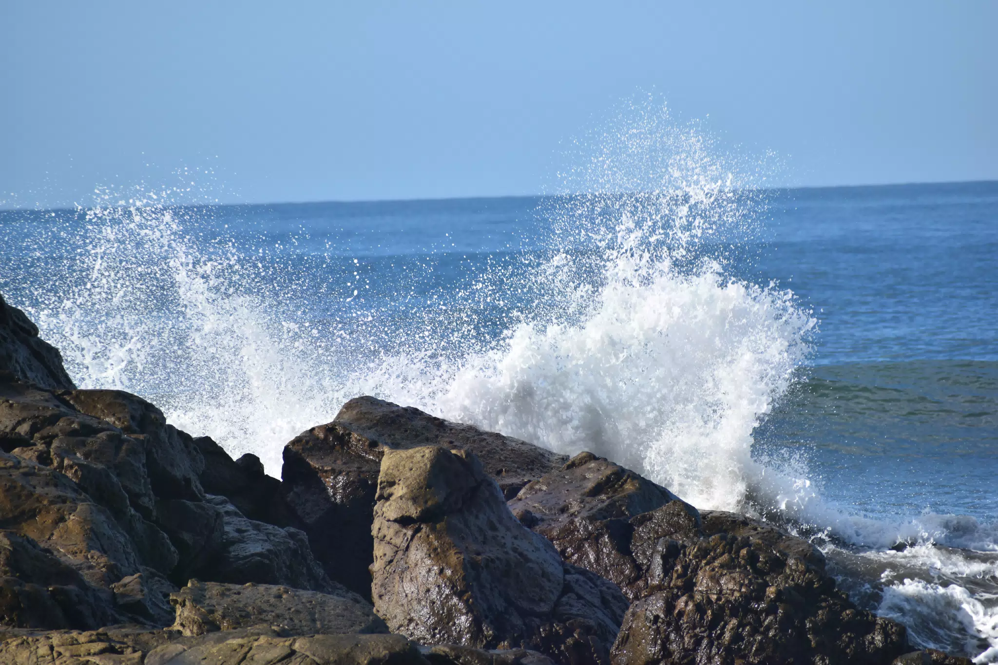Waves Crashing on Rocks at Las Peñitas Beach