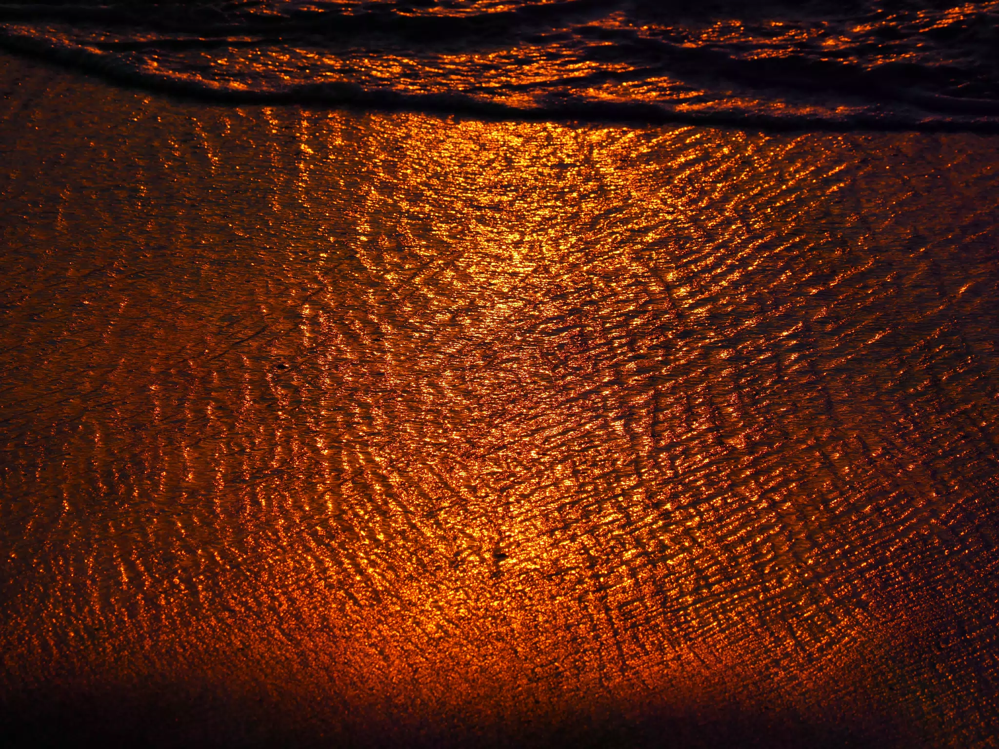 Sunset Reflection Off of the Las Peñitas Beach Sand