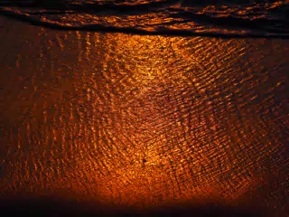 Sunset Reflection Off of the Las Peñitas Beach Sand