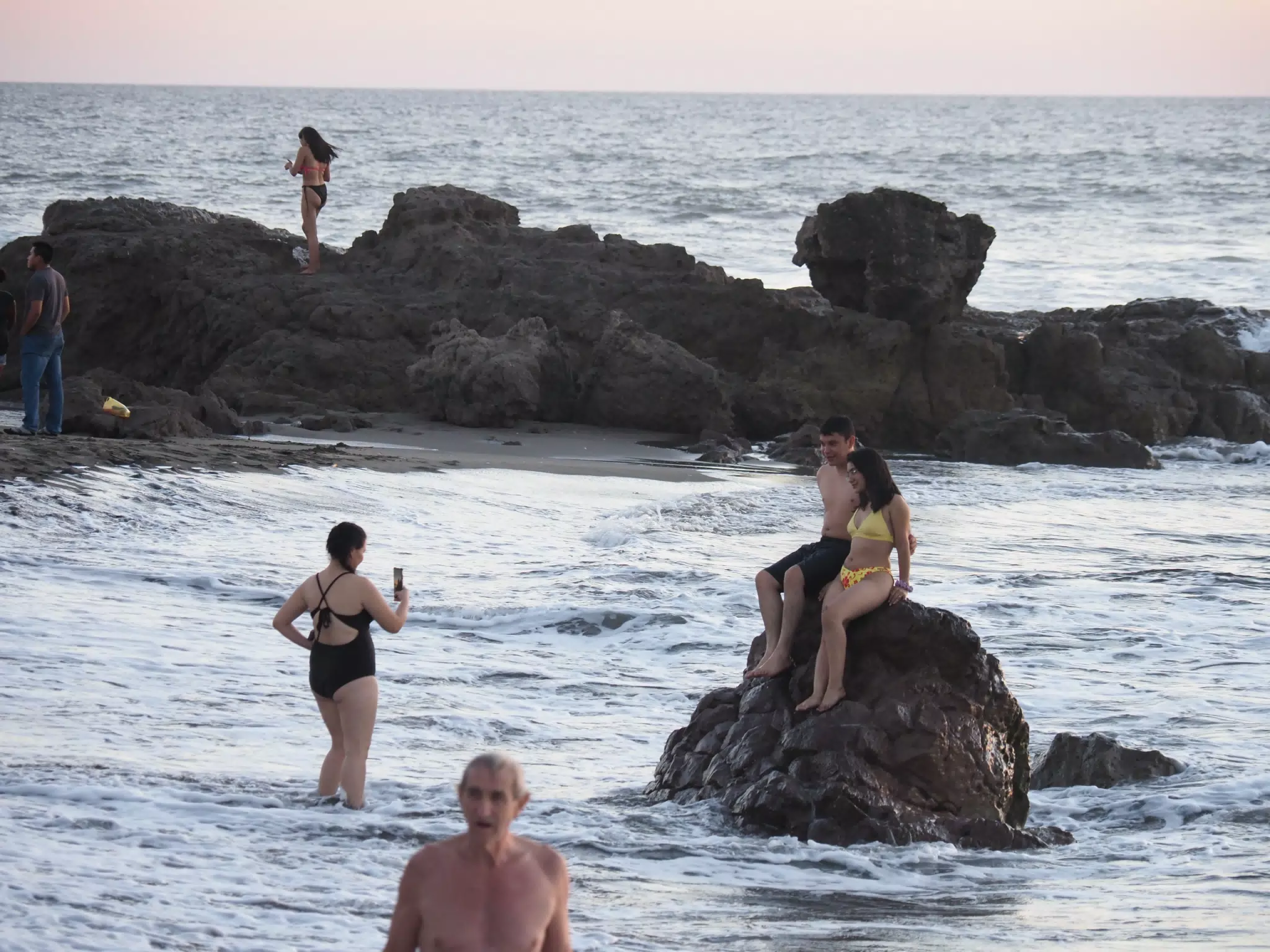 Taking Pictures on the Rocks at High Tide