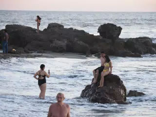 Taking Pictures on the Rocks at High Tide