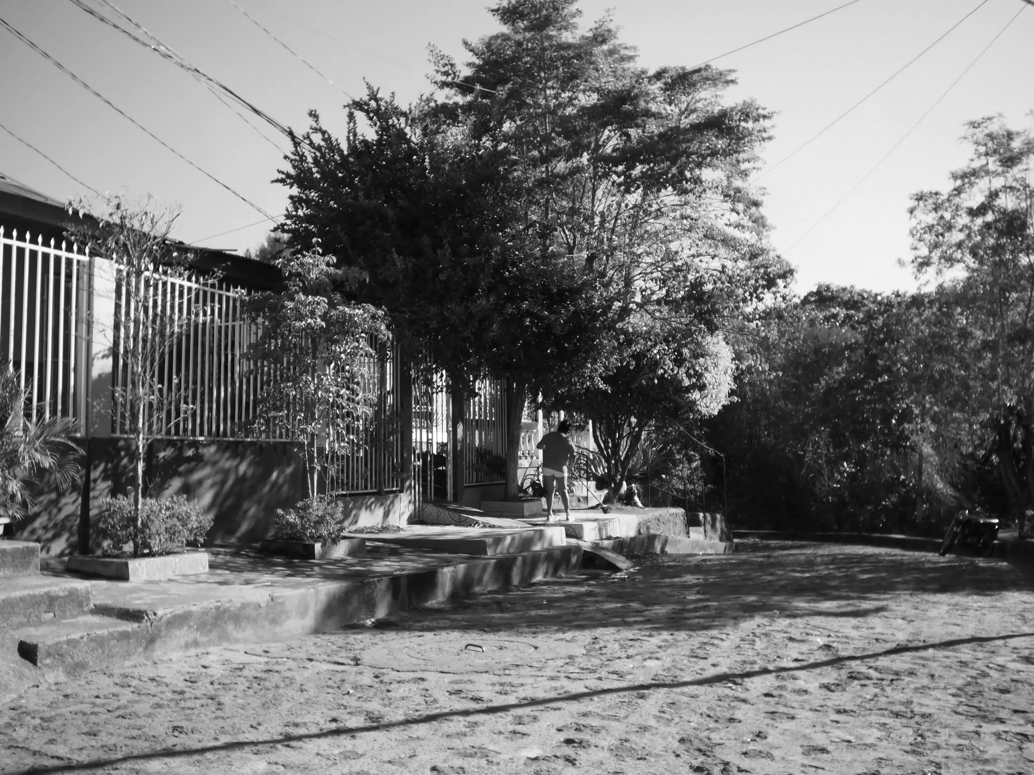 Cleaning the Sidewalk in Leon