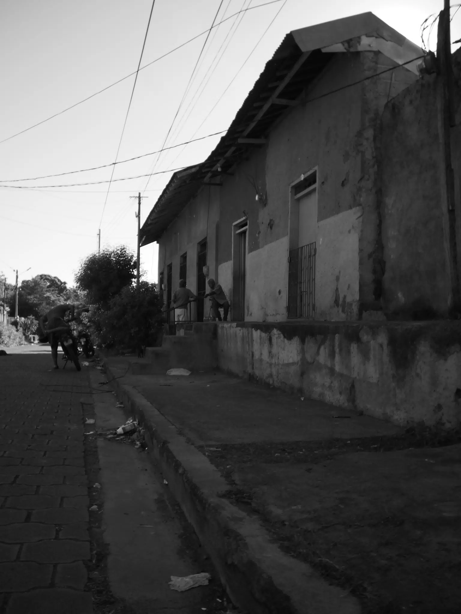 Men on Porch in Leon