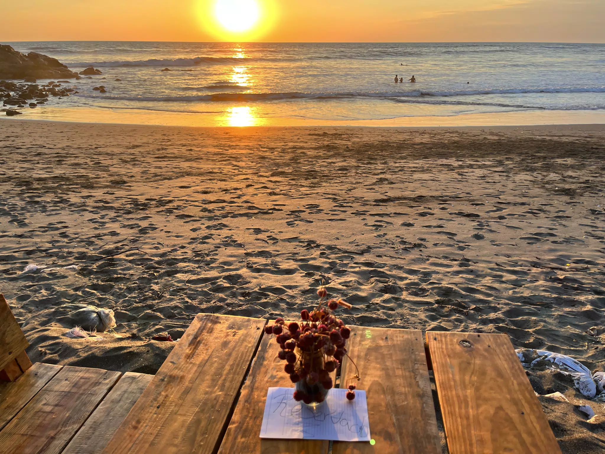 Sunset Over Reserved Beach Table at the Simple Beach Lodge on the Pacific Ocean