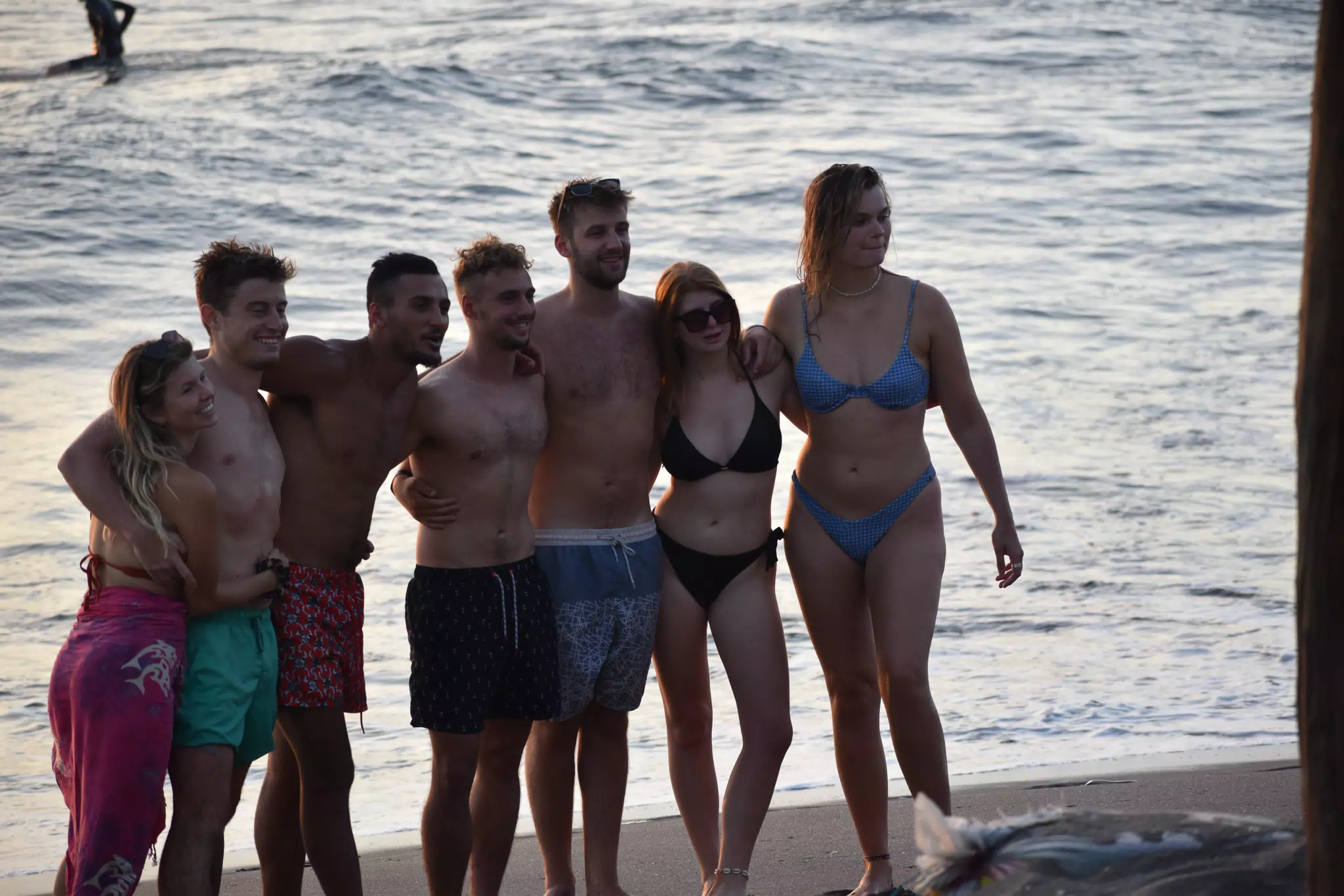 Tourists on Las Peñitas Beach at El Simple in Swimsuits