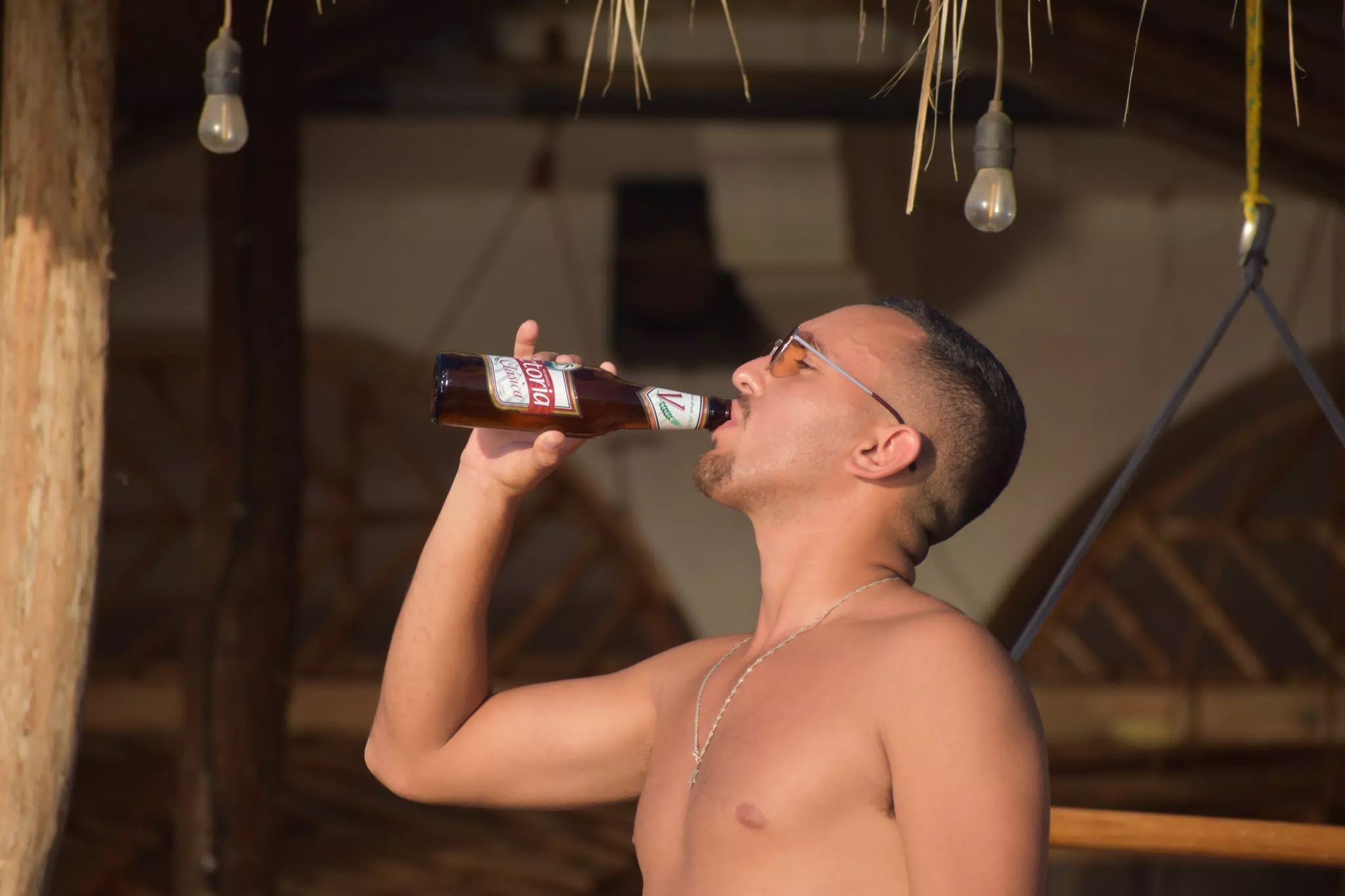 Drinking a Victoria Clasica Beer on the Beach in Las Peñitas Nicaragua