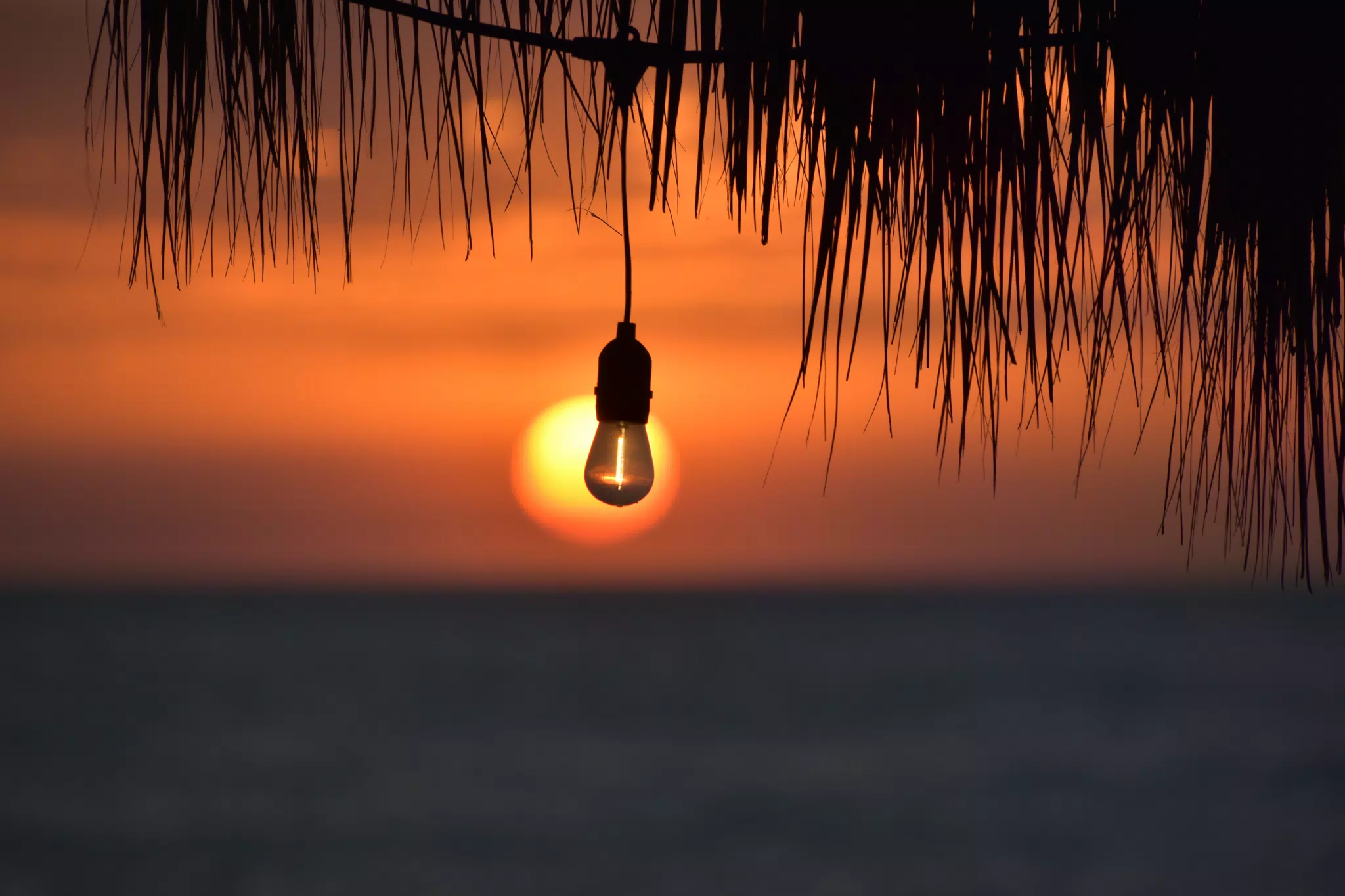 Sunset with Lightbulb at El Simple Beach Lodge, Las Peñitas, Nicaragua