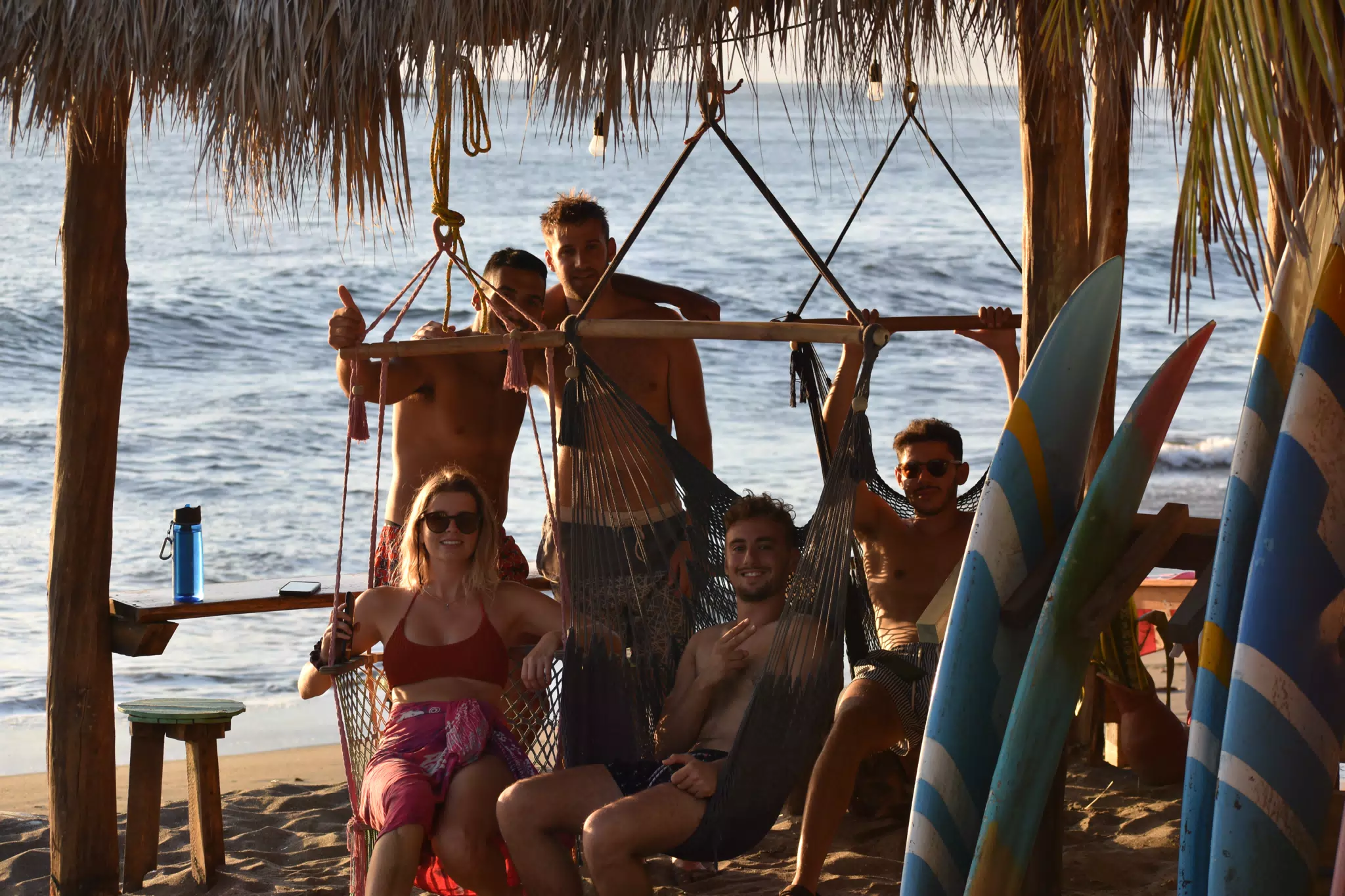People Relaxing by the Pacific at the Simple Beach Lodge