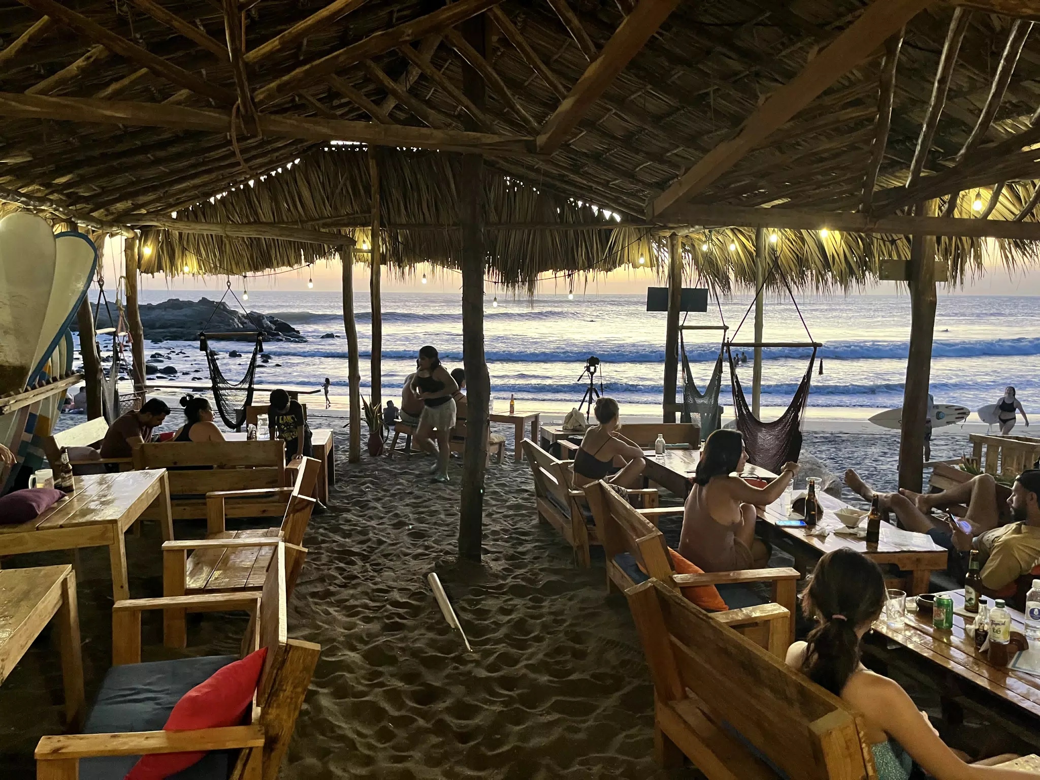 Diners at Sunset at the Simple Beach Lodge Restaurant in Nicaragua