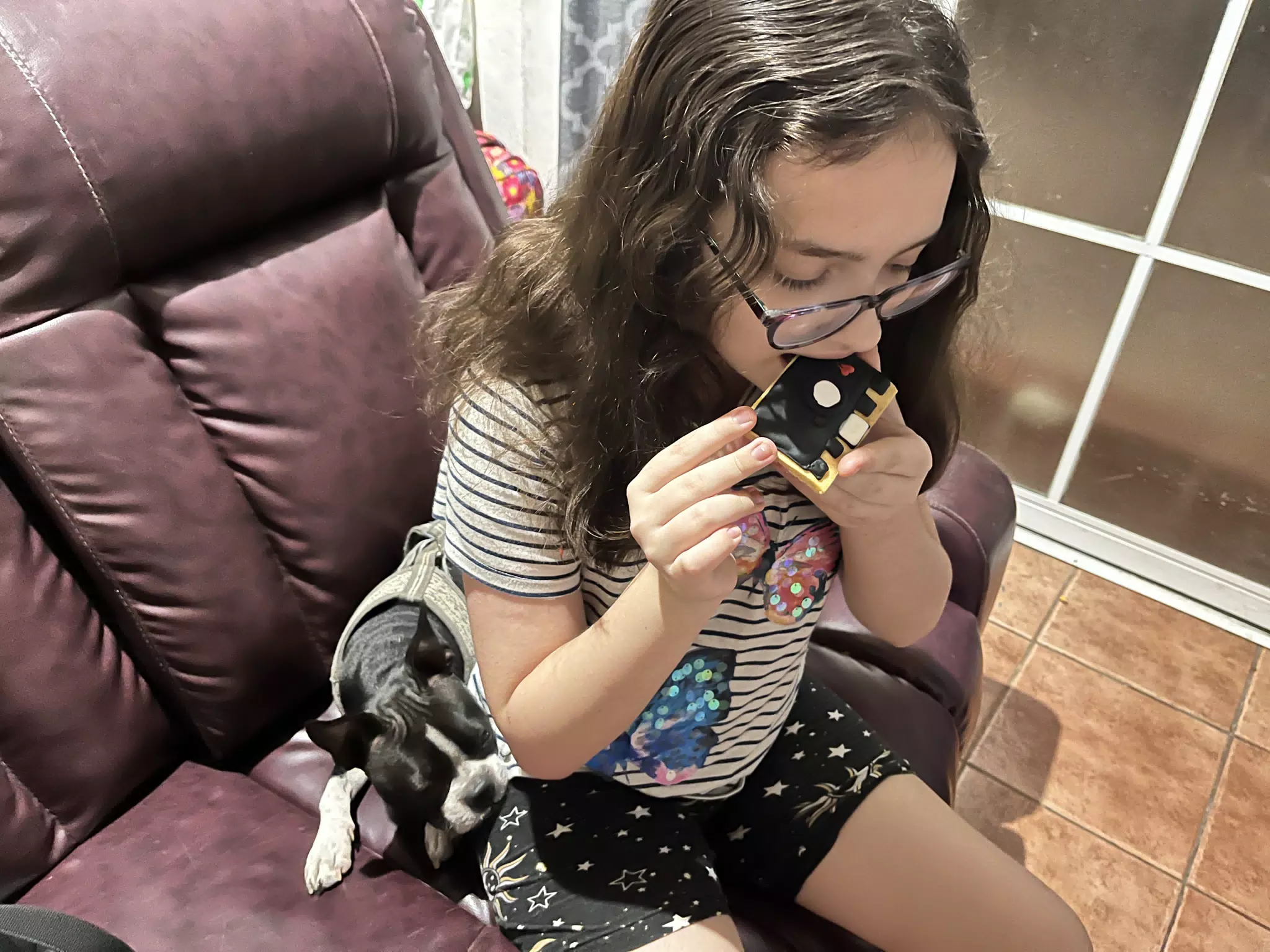 Luciana Eating a Camera Cookie