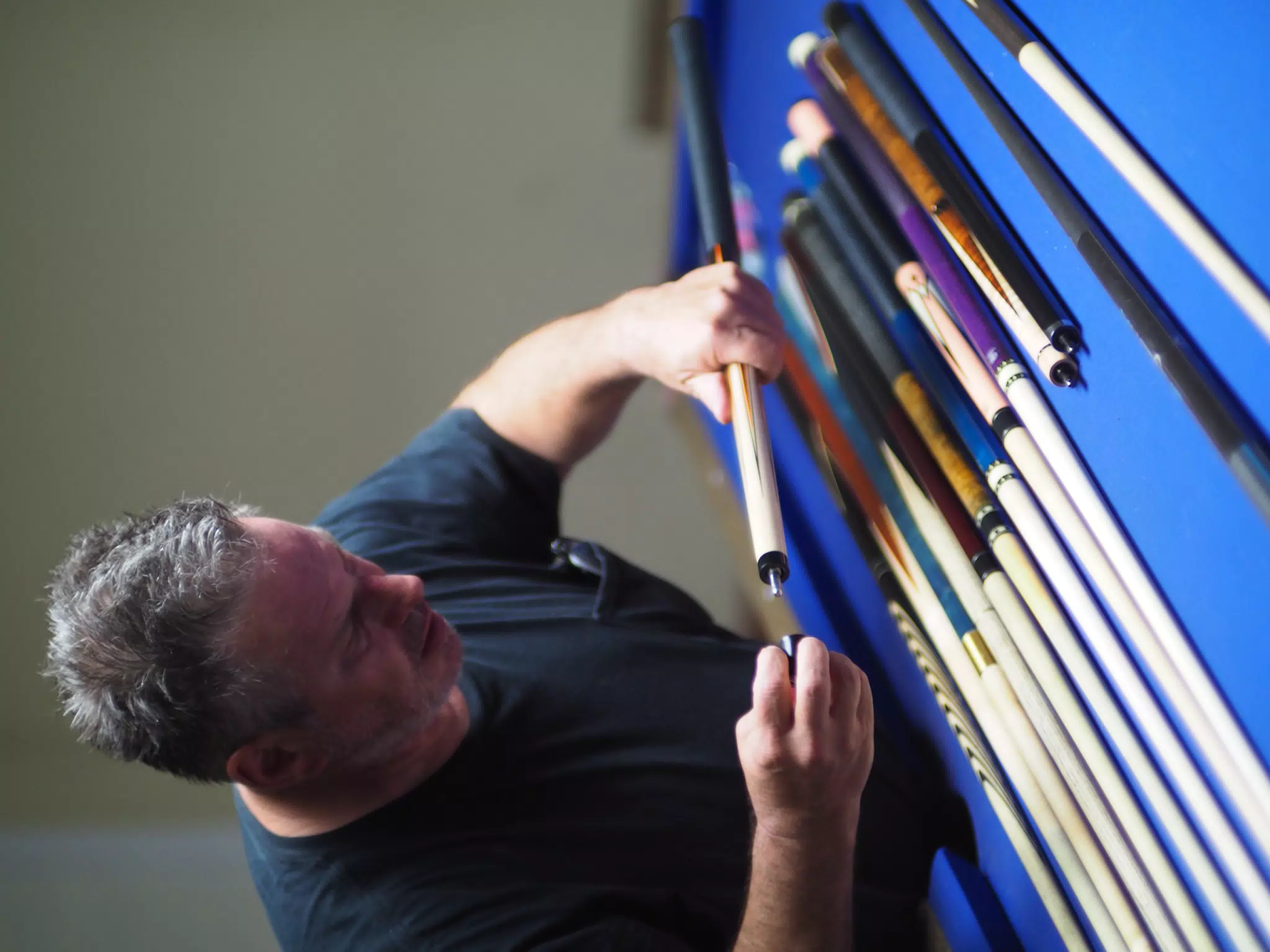 Paul Checking Pool Cues