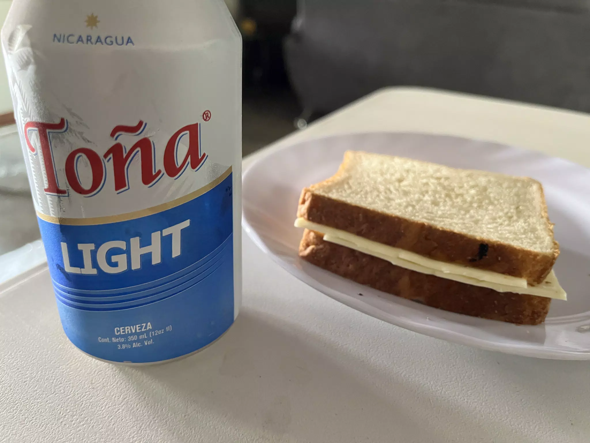 Toña Light and a Cheese Sandwich