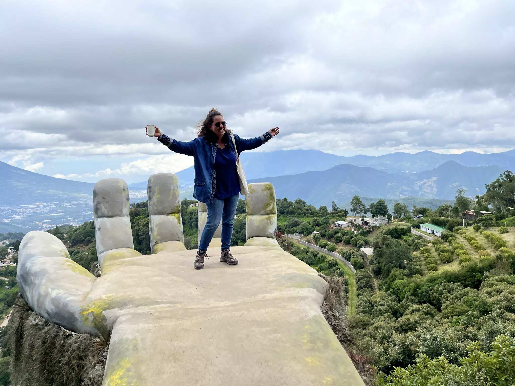 Ivonne in Jeans on the Giant Hand in HobbiTenango Guatemala