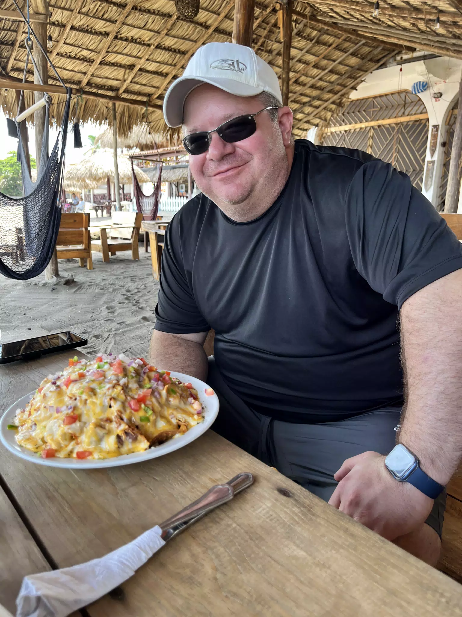 Brian with Nachos at the Simple Beach Lodge