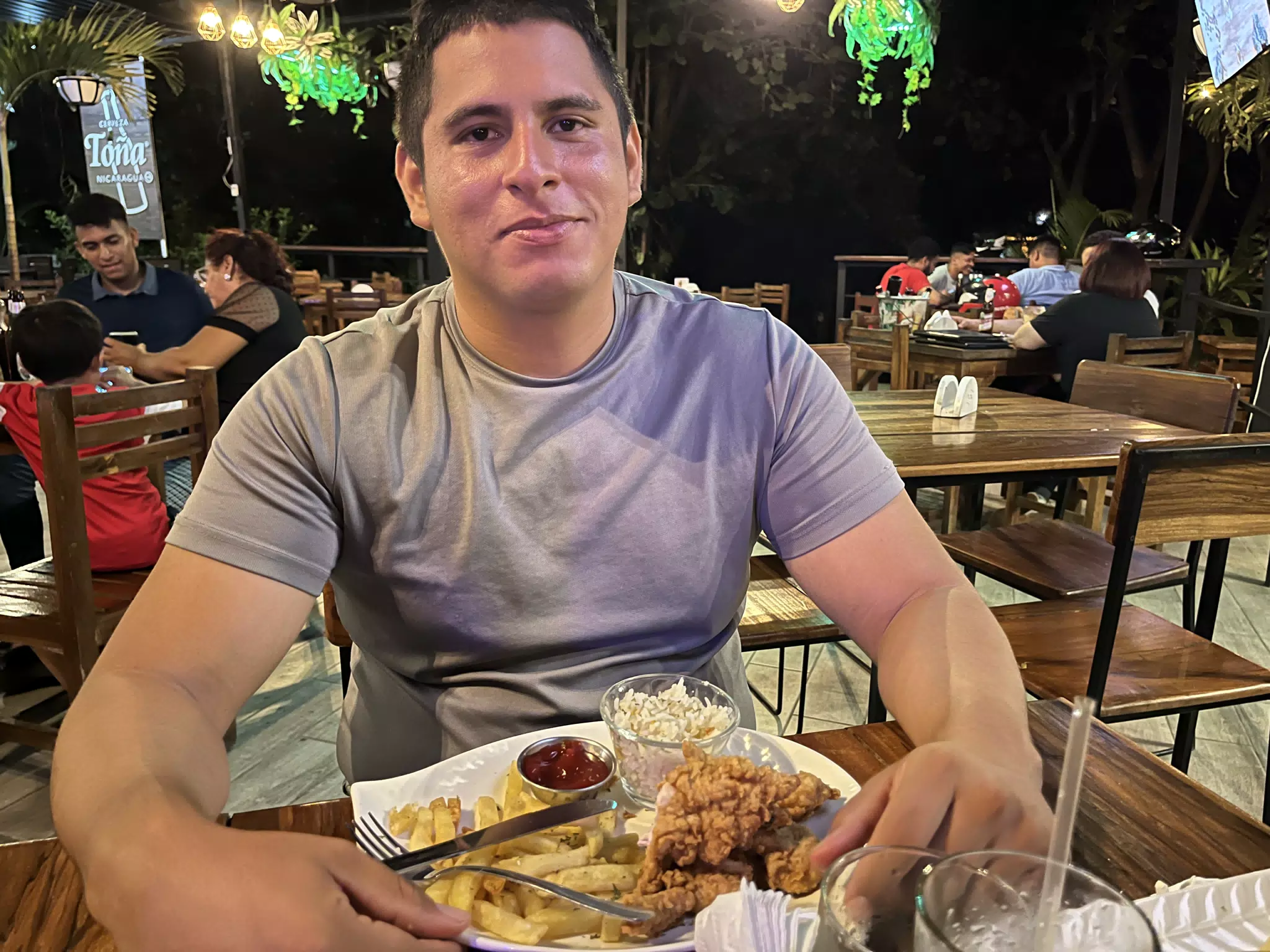 Cris with Fried Chicken at En el Vivero, Leon, Nicaragua