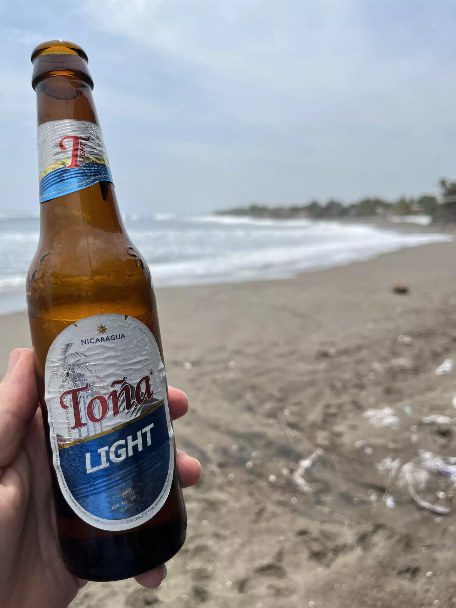 Toña Light on the Beach in Playa Las Peñitas, Nicaragua