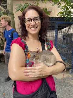 Dominica Holding a Giant Mine Sniffing Rat