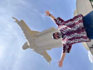 Scott with Statue of Christ in Cochabamba Bolivia