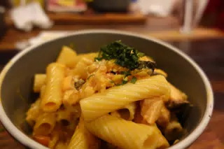 Salmon Pasta with Garlic Bread at SUA León Nicaragua
