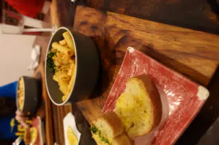 Salmon Pasta with Garlic Bread at SUA León Nicaragua