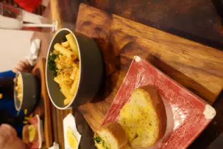 Salmon Pasta with Garlic Bread at SUA León Nicaragua