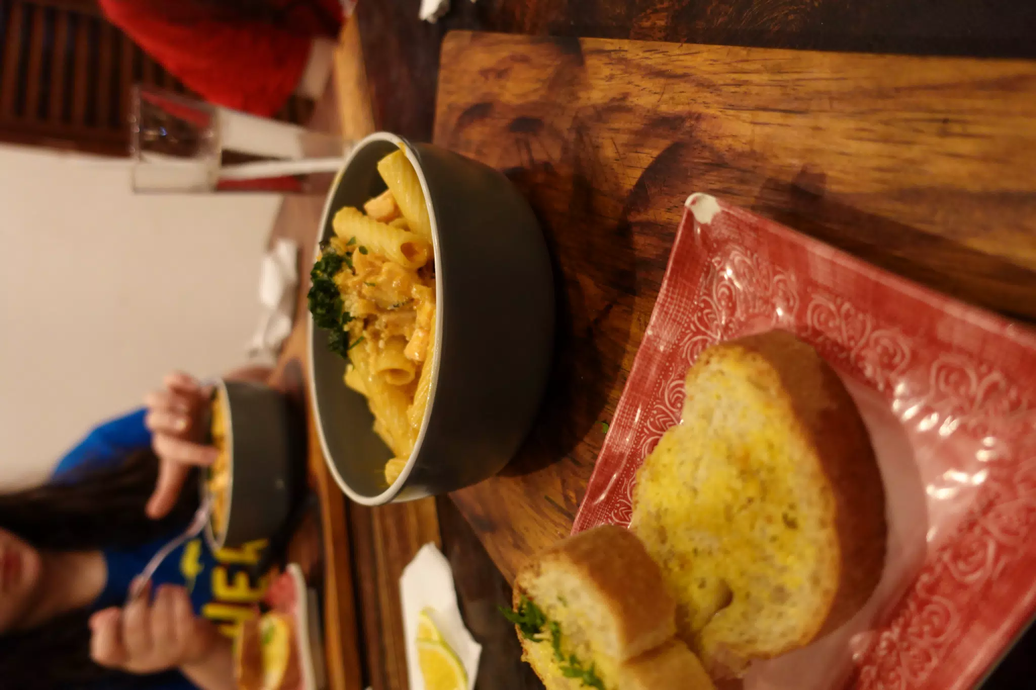 Salmon Pasta with Garlic Bread at SUA León Nicaragua