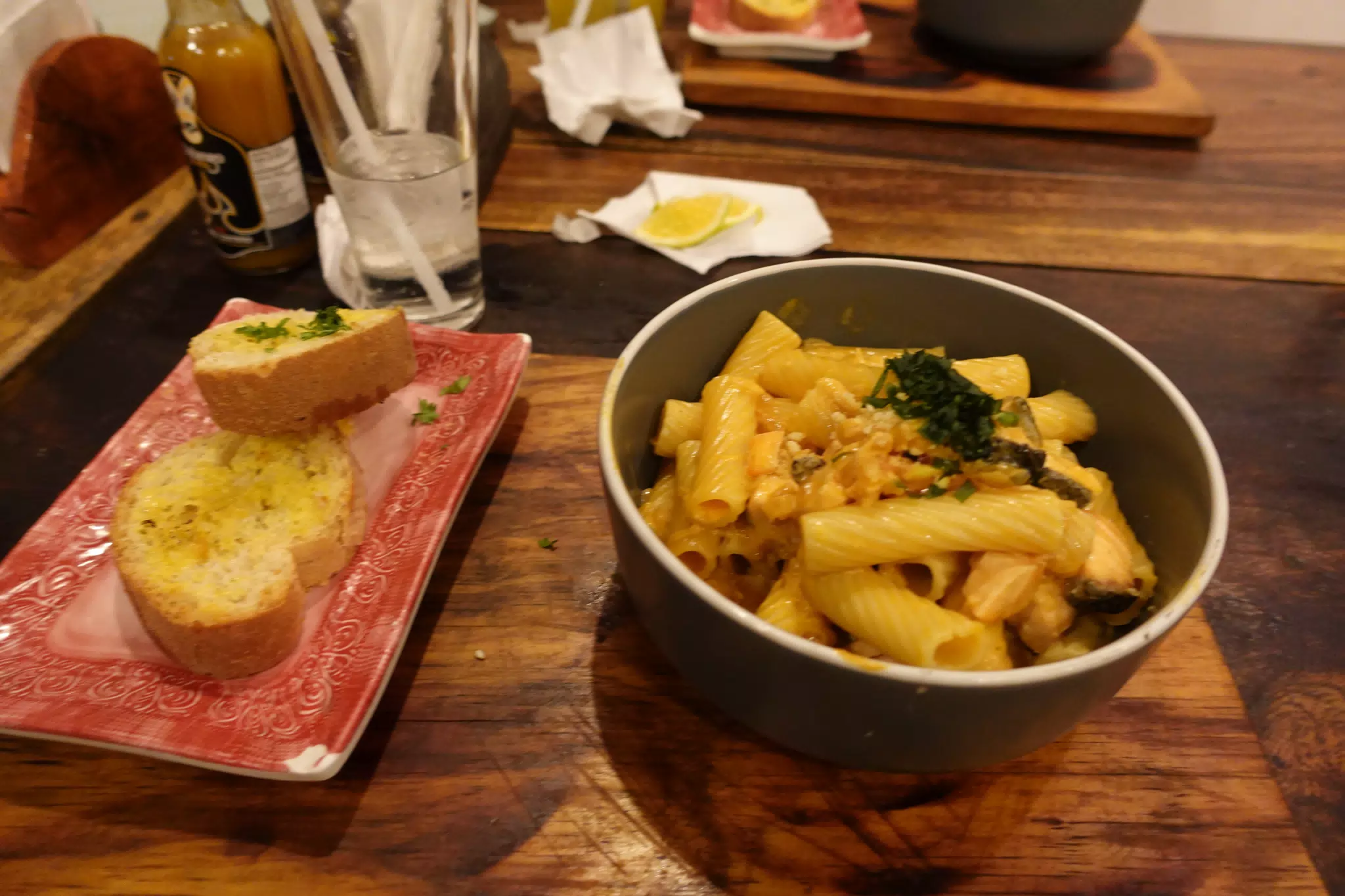 Salmon Pasta with Garlic Bread at SUA León Nicaragua