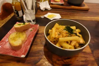 Salmon Pasta with Garlic Bread at SUA León Nicaragua
