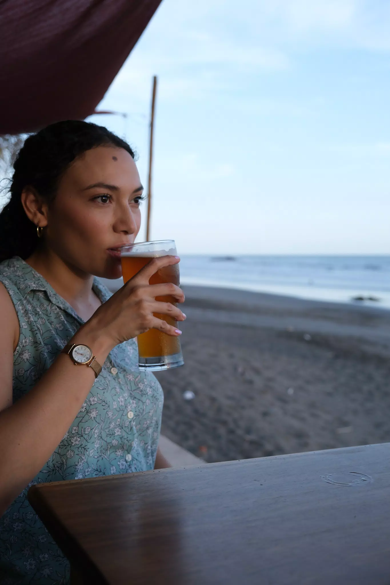 Isabel Drinking a Beer on the Beach