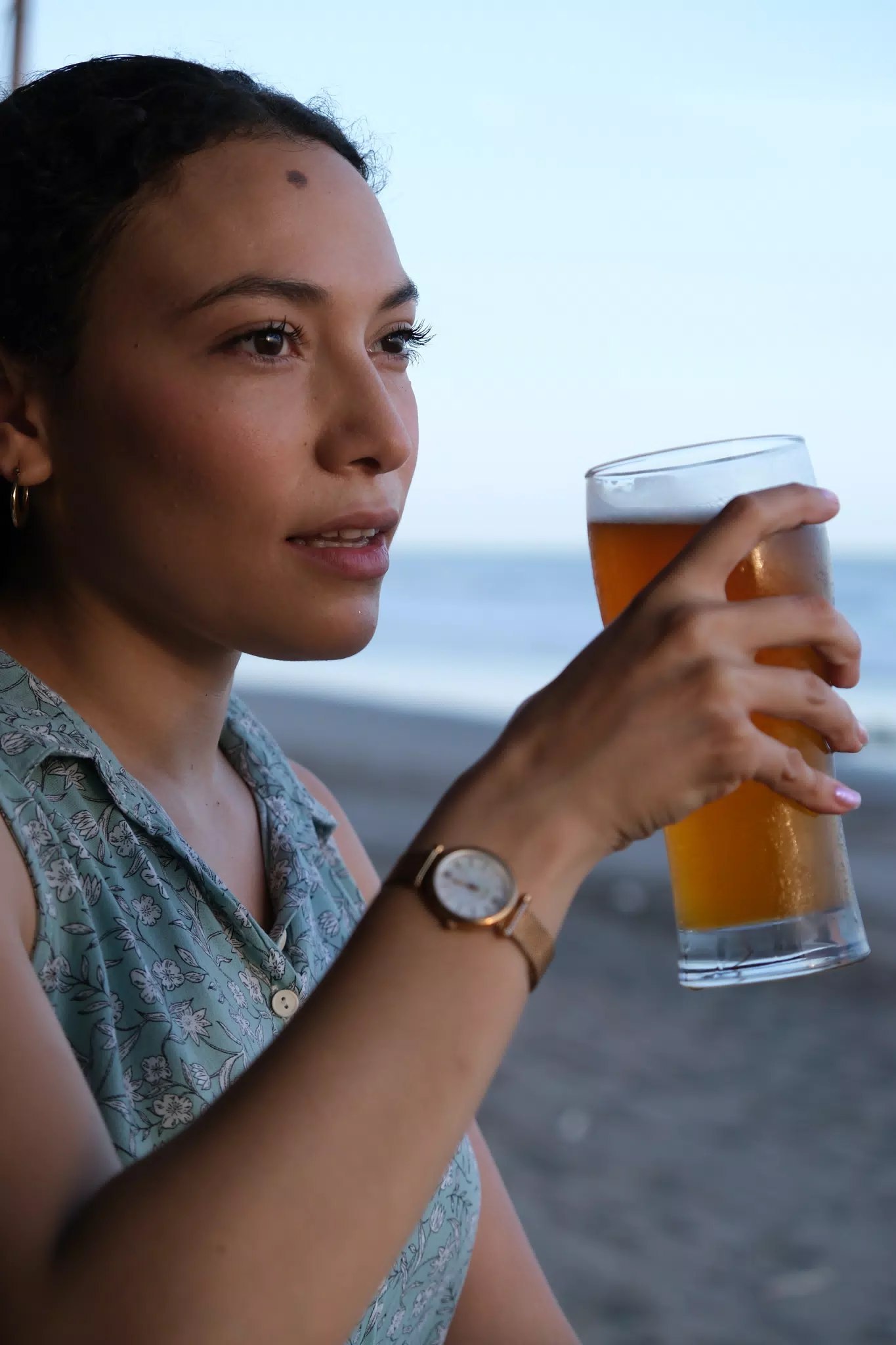 Isabel with a Beer on the Beach