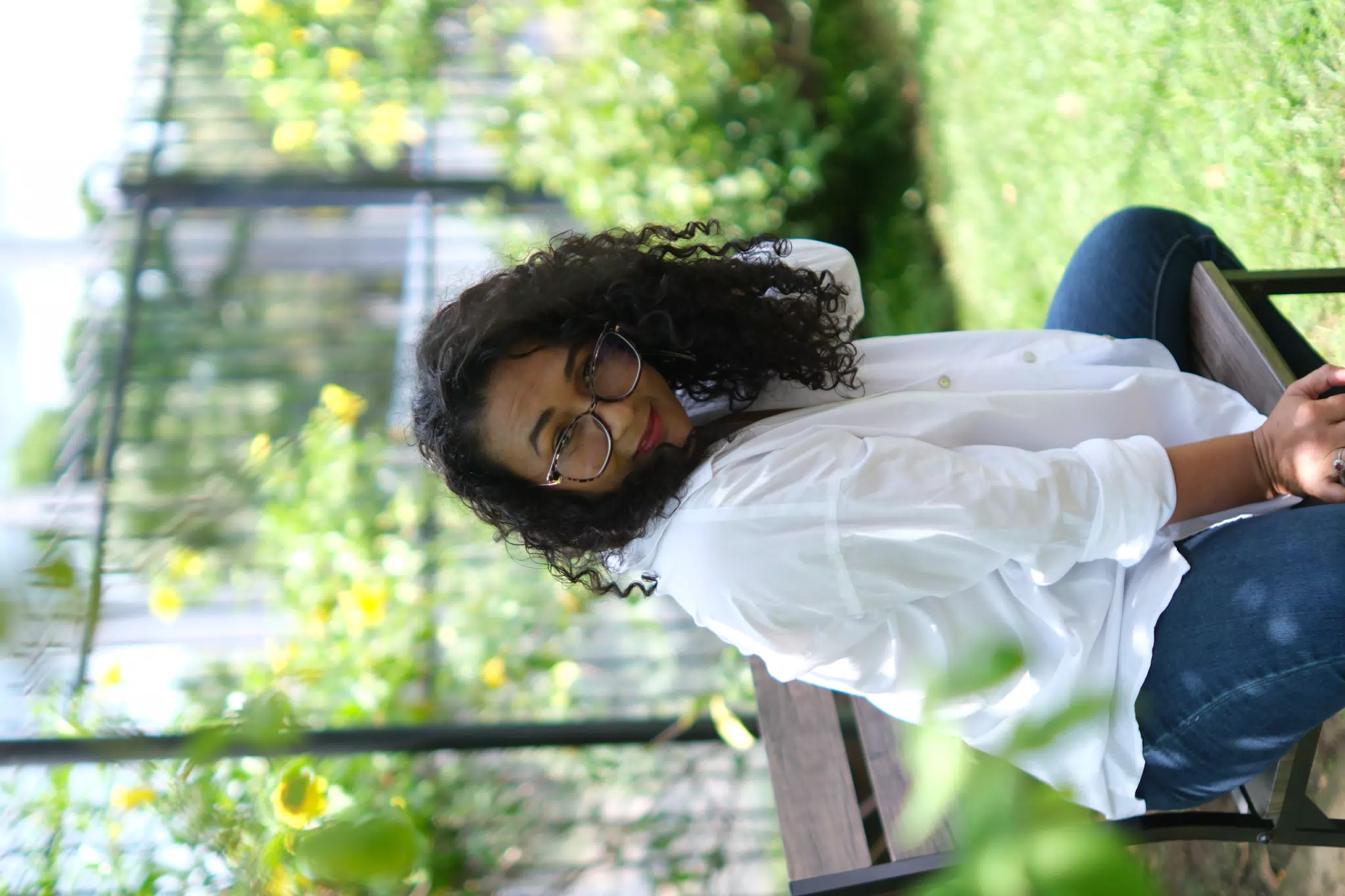 Aida Posing in the Garden with Glasses