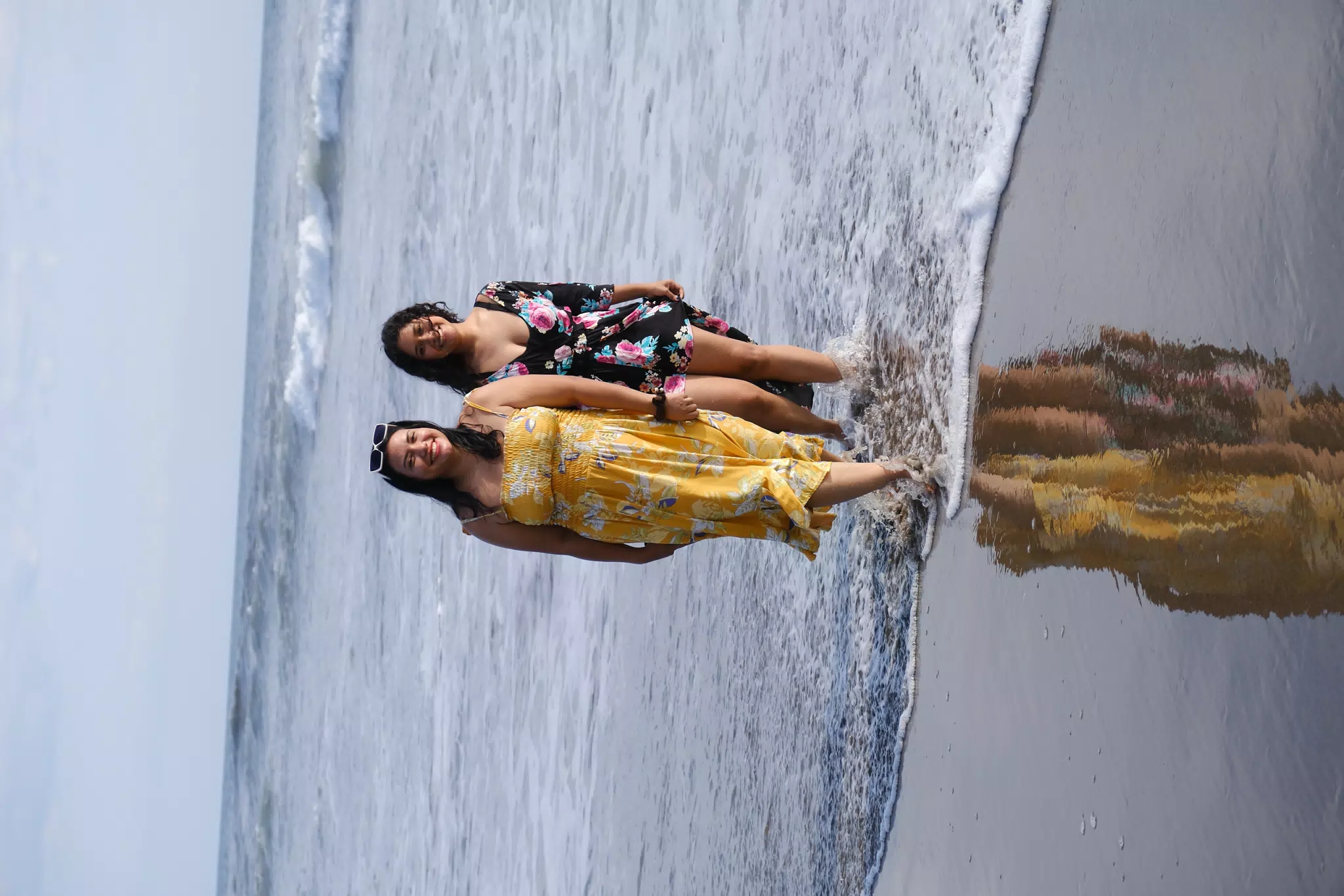Sisters in the Pacific Ocean in Las Peñitas Nicaragua