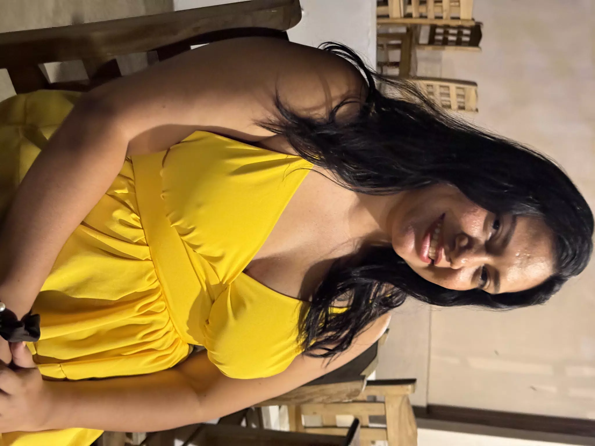 Eva Seated at Dinner in Desperados in Bright Yellow Dress