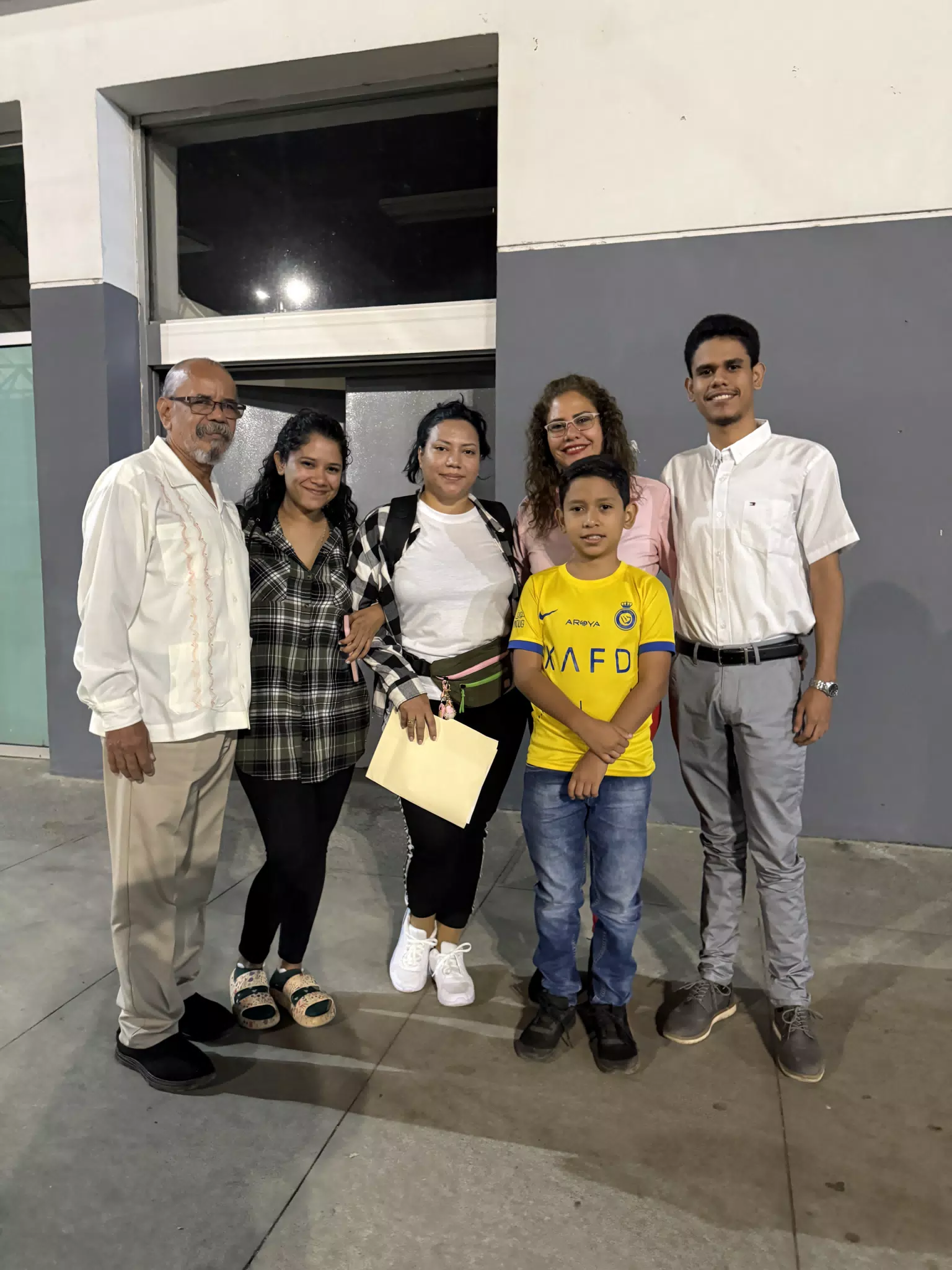 Eva with Her Family at Airport