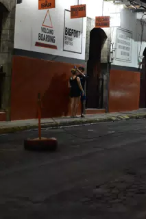 People on Street in Front of Bigfoot Hostel Leon