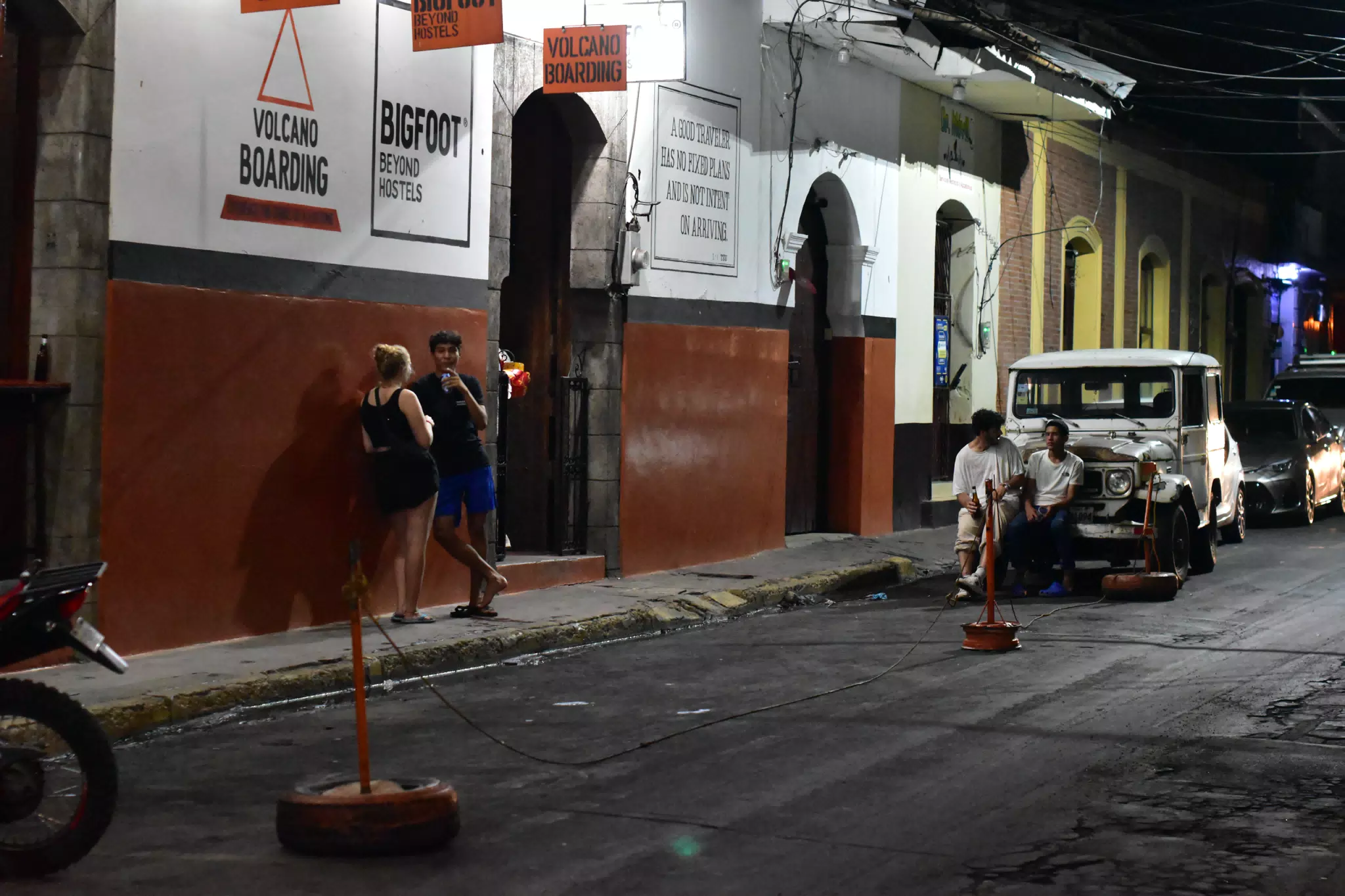 People on Street in Front of Bigfoot Hostel, Leon, Nicaragua