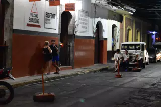 People on Street in Front of Bigfoot Hostel, Leon, Nicaragua