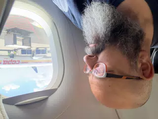 Scott Looking Out Airplane Window