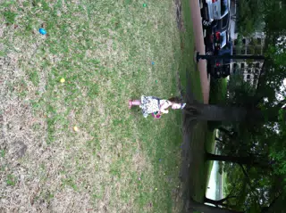 Liesl on the Lawn Hunting for Easter Eggs