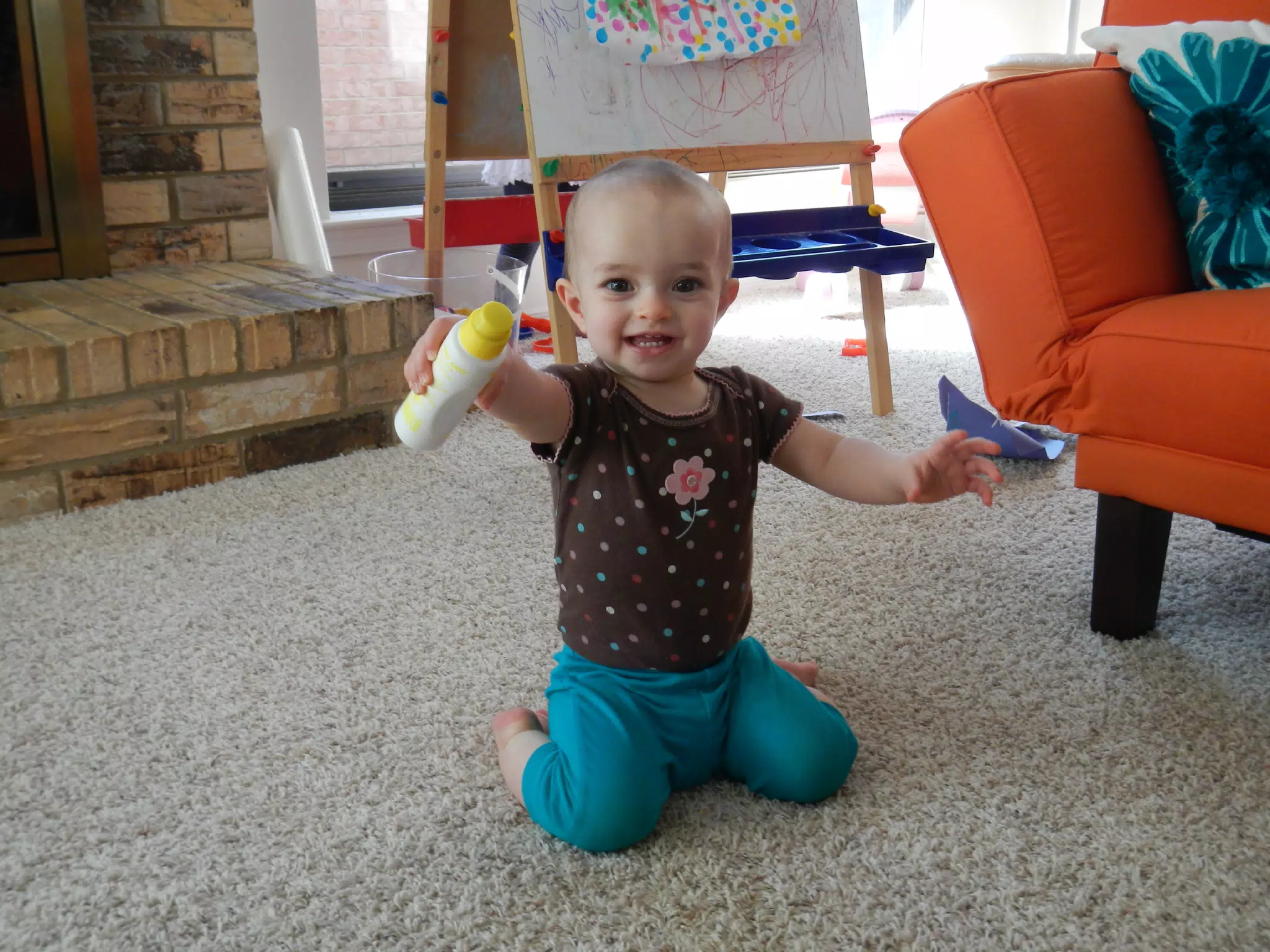 Luciana Playing with a Paint Bottle