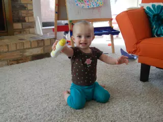 Luciana Playing with a Paint Bottle