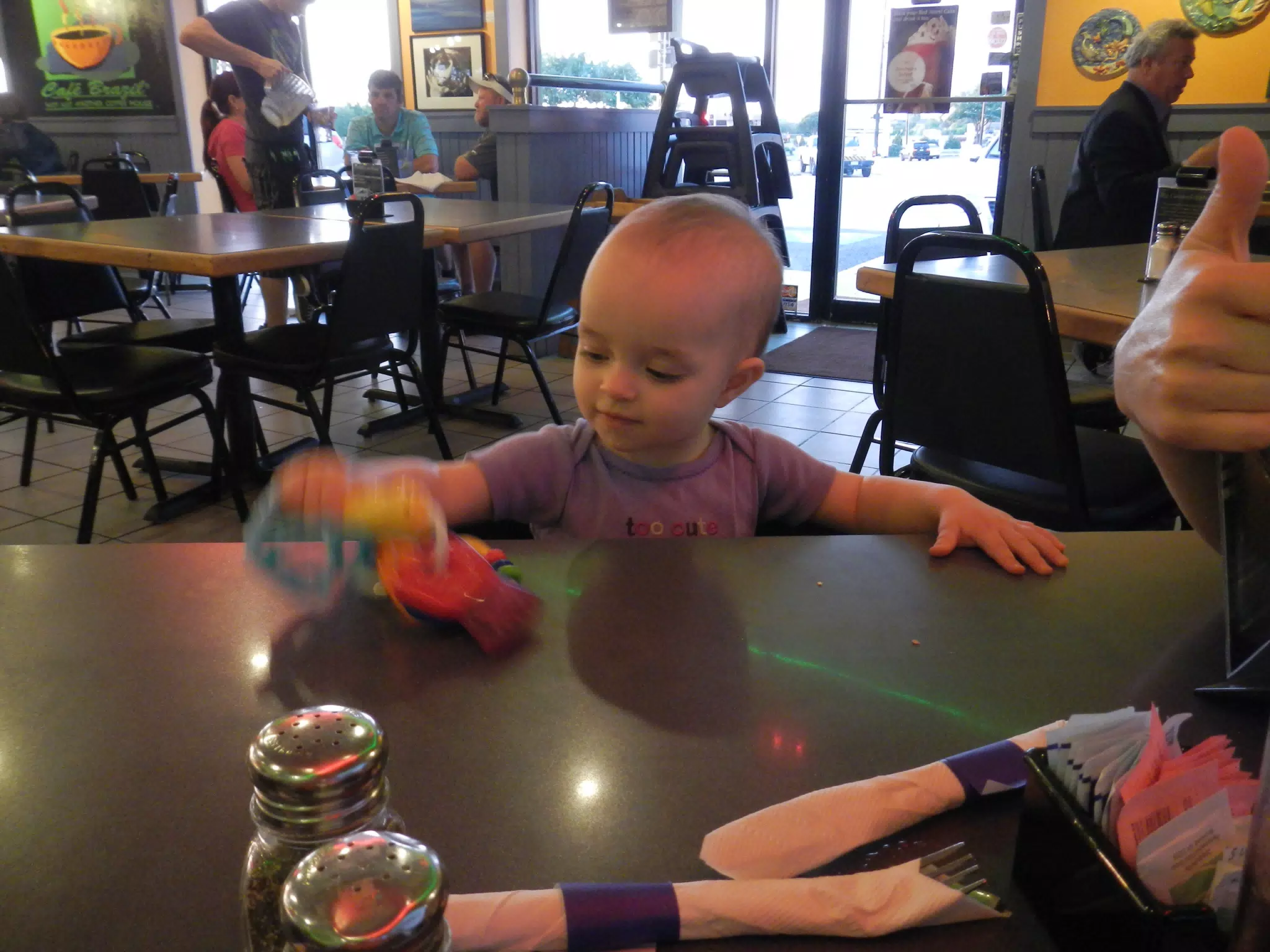 Luciana Playing with Key at Cafe Brazil