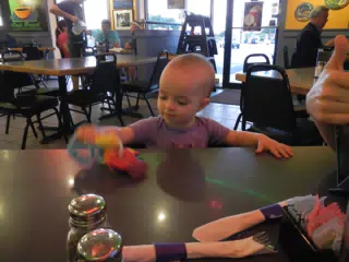 Luciana Playing with Key at Cafe Brazil