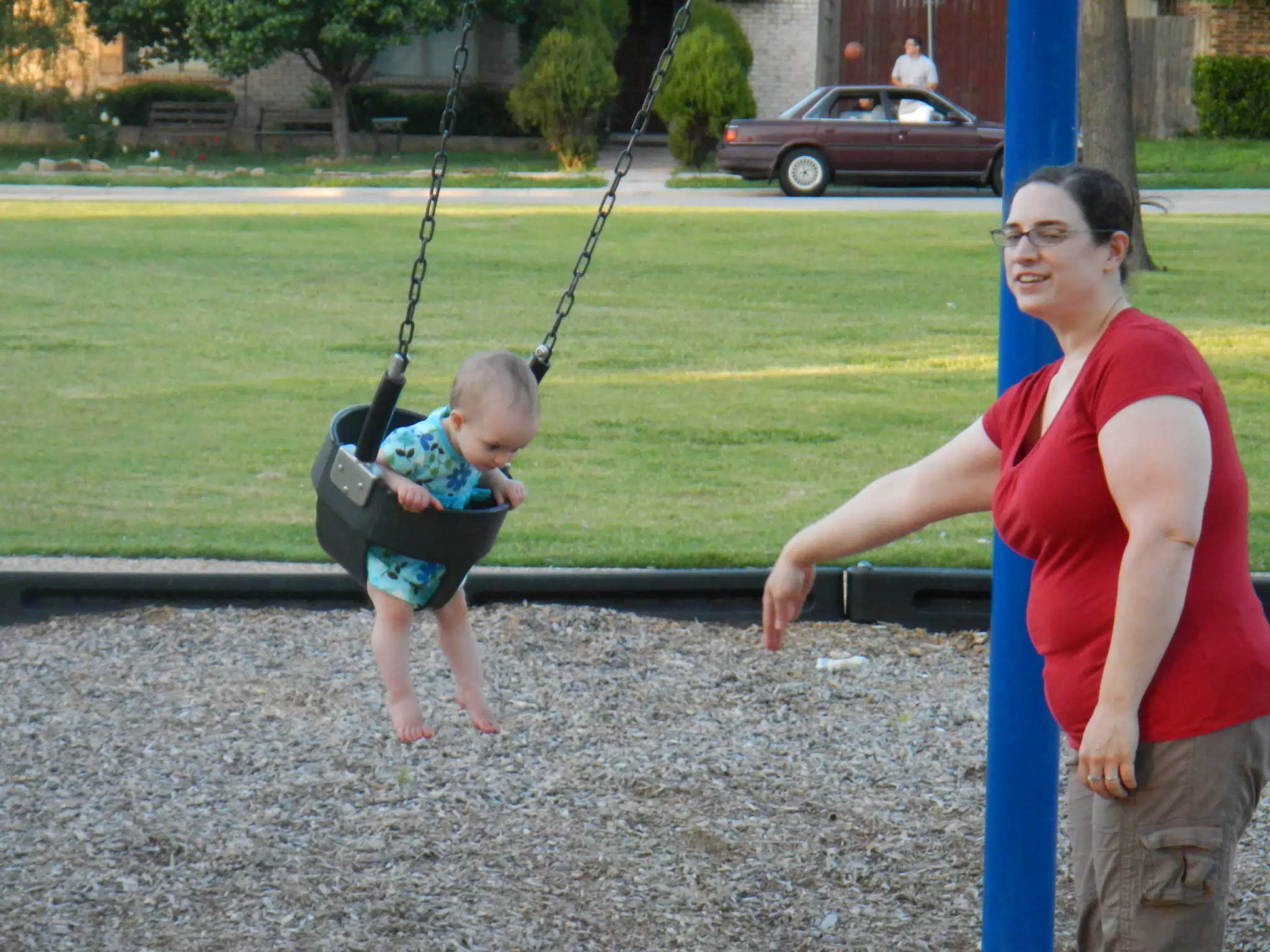 Dominica Pushing Luciana on the Swing
