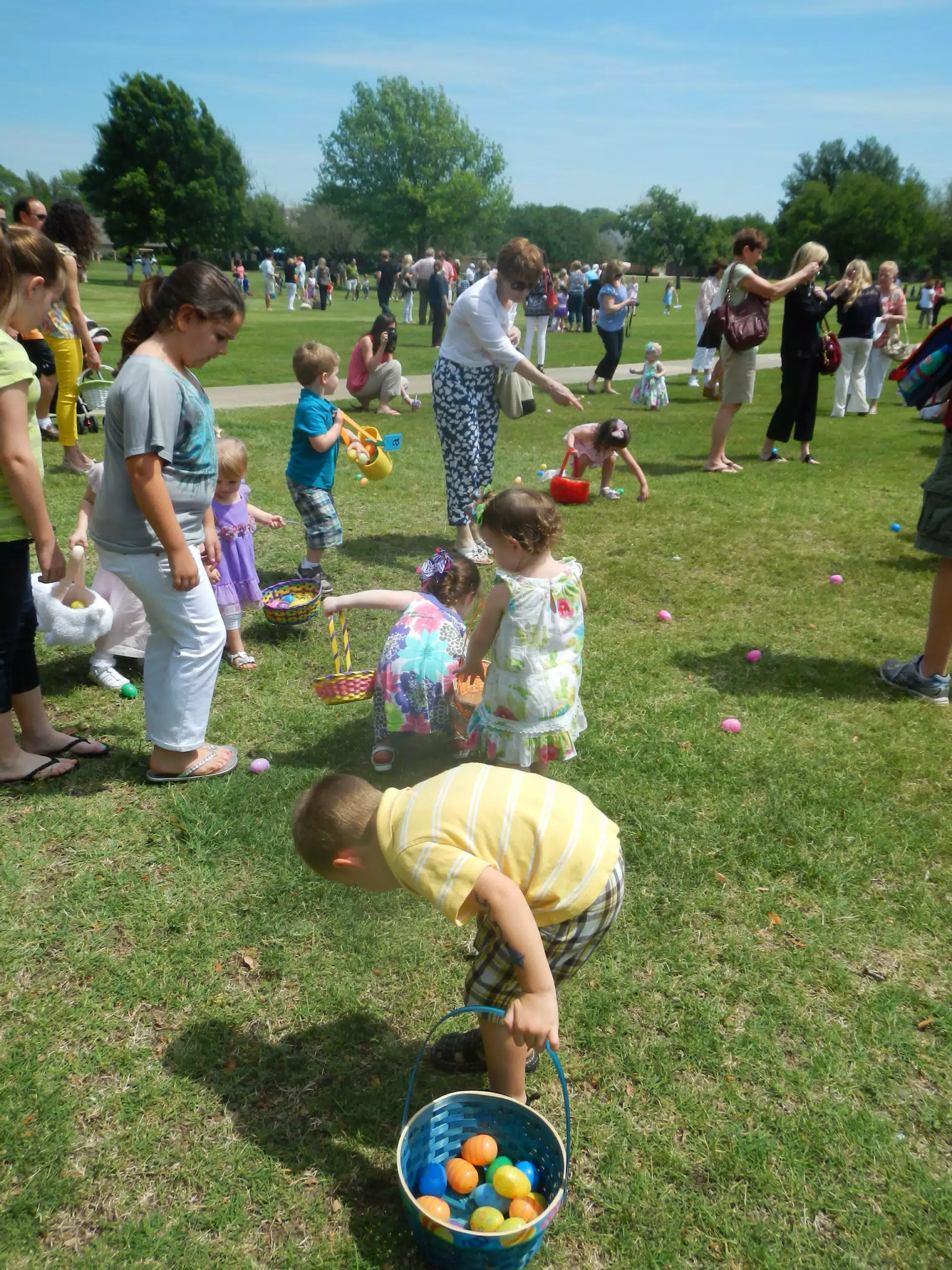 Garrett and Liesl Collecting Easter Eggs